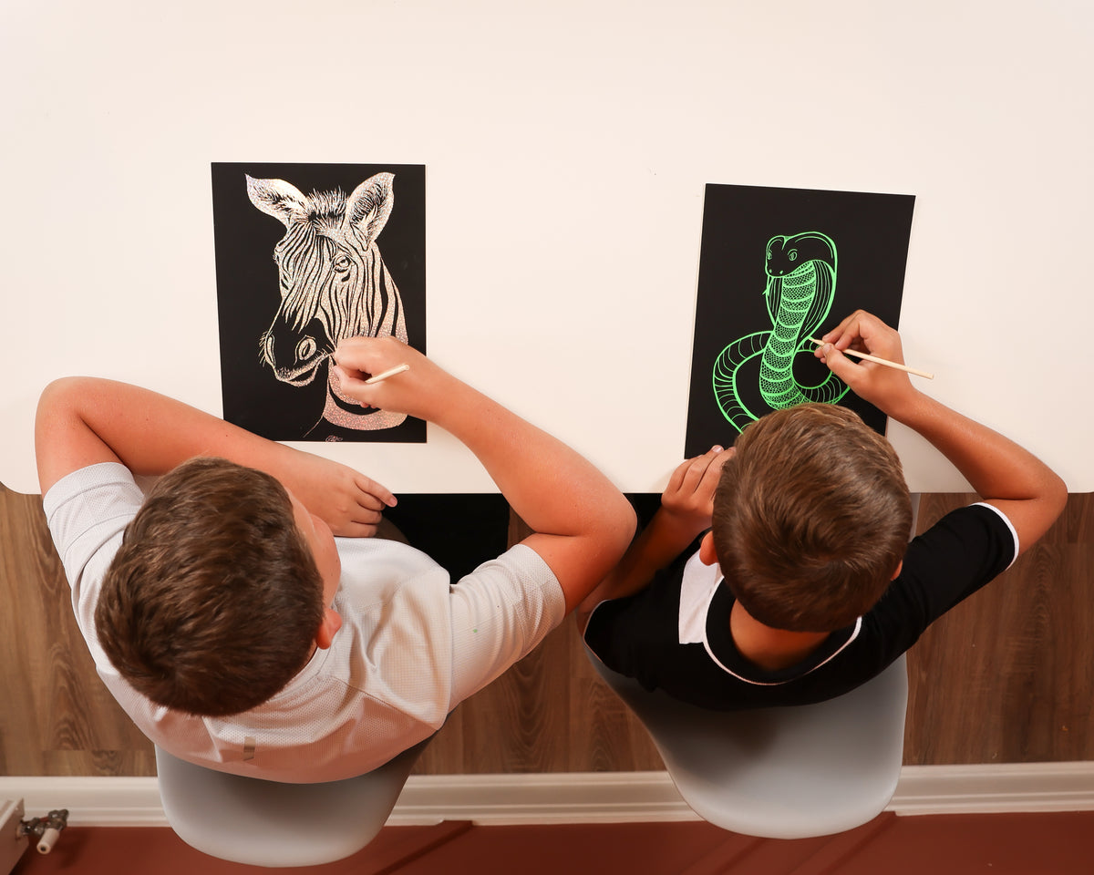A package of Marvin&#39;s Magic Super Bright Scratch Art featuring a colorful design on the cover with a scratch art tool illustrated in the foreground.