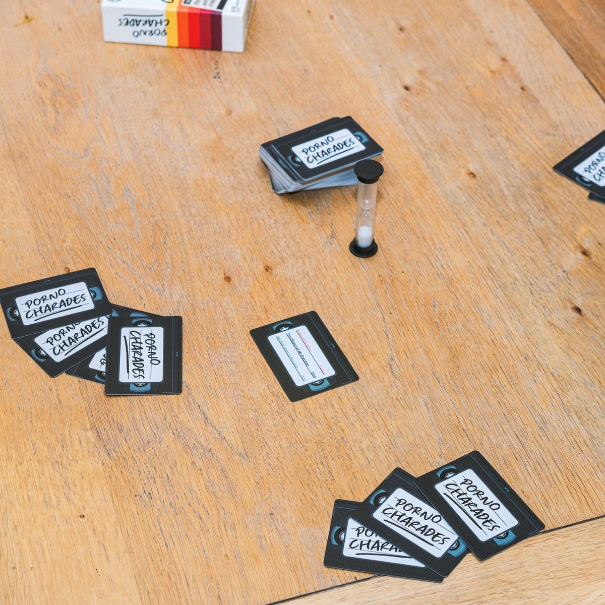 Playing cards with text on a wooden surface