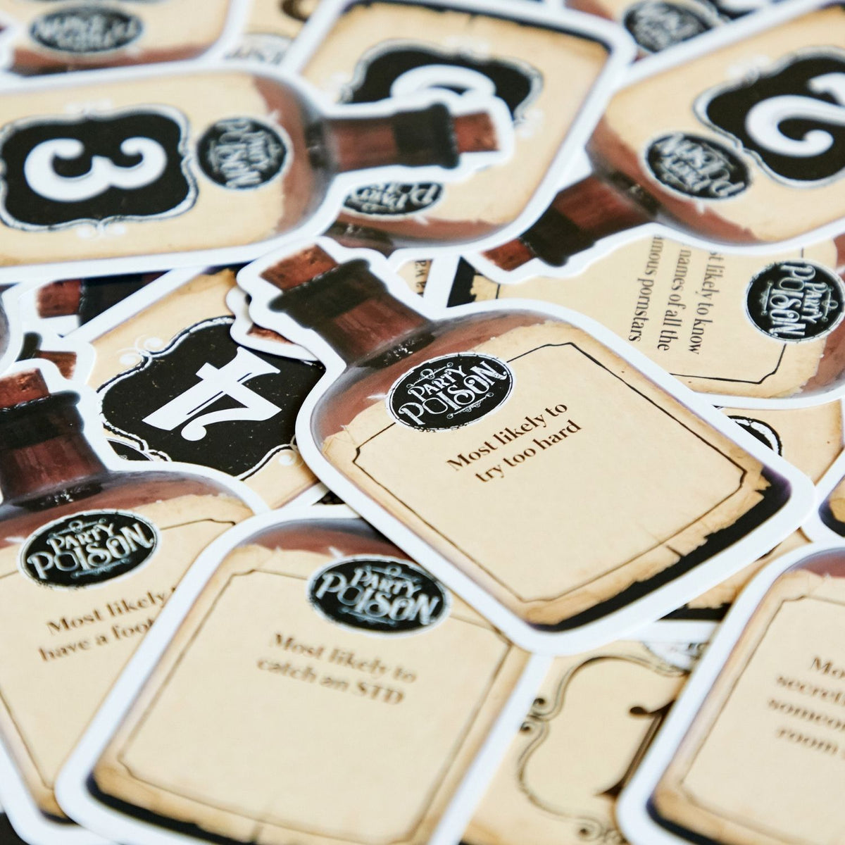 A boxed party game called &#39;Party Poison - Most Likely To&#39; with a dark and vintage-style design, featuring a skull and crossbones symbol.