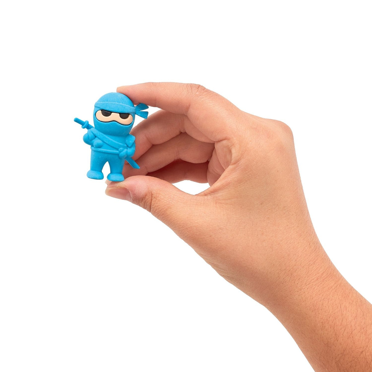 A set of three ninja-themed erasers in blue, red, and black colors packaged in a red box with a clear plastic window displaying the items.
