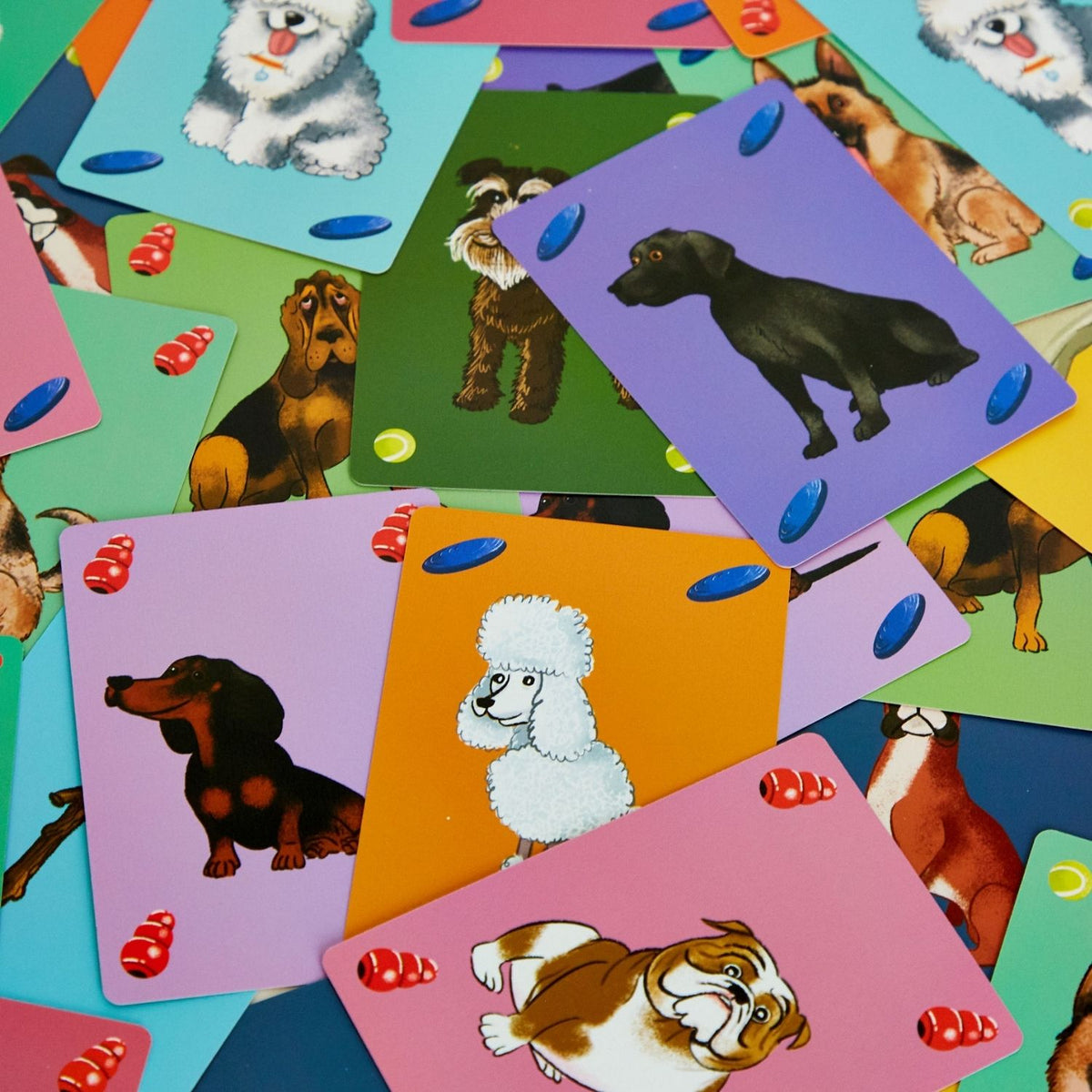 A boxed card game titled &#39;PanDogMonium&#39; featuring colorful illustrations of dogs and dog toys on a blue background.