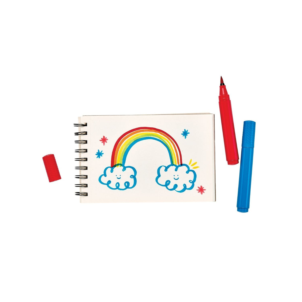 Big Bright Brush Markers from Ooly with a drawing of a rainbow on a colouring book