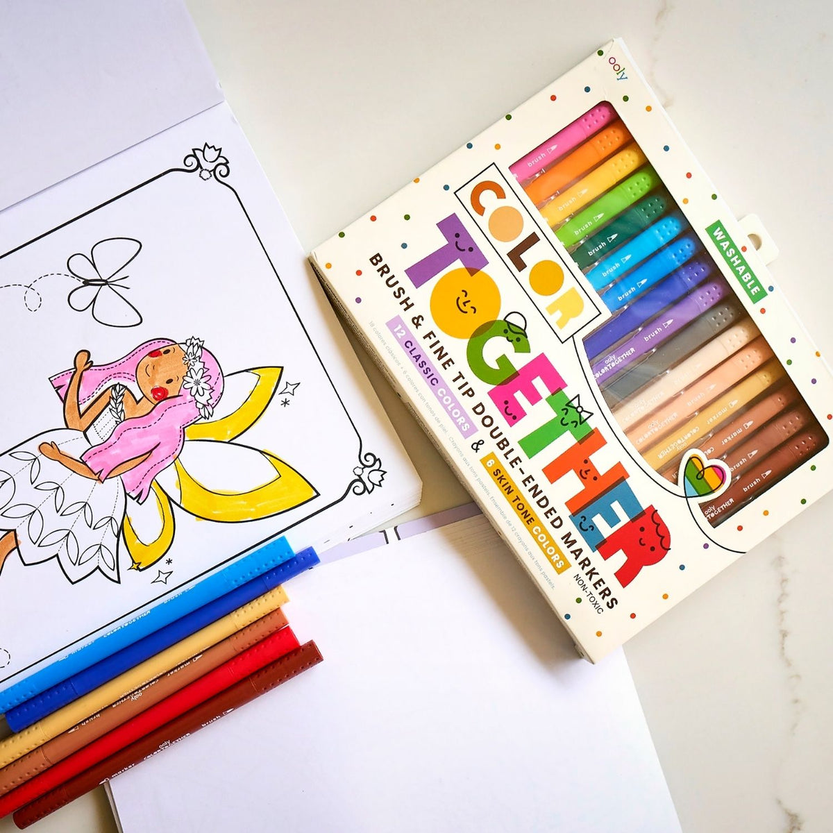 a colouring book with a pack of colour together markers