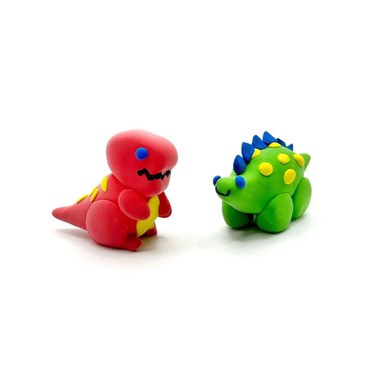 Models of Creatibles Mini Air Dry Clay Kit with colorful clay pieces and a dinosaur friend design.