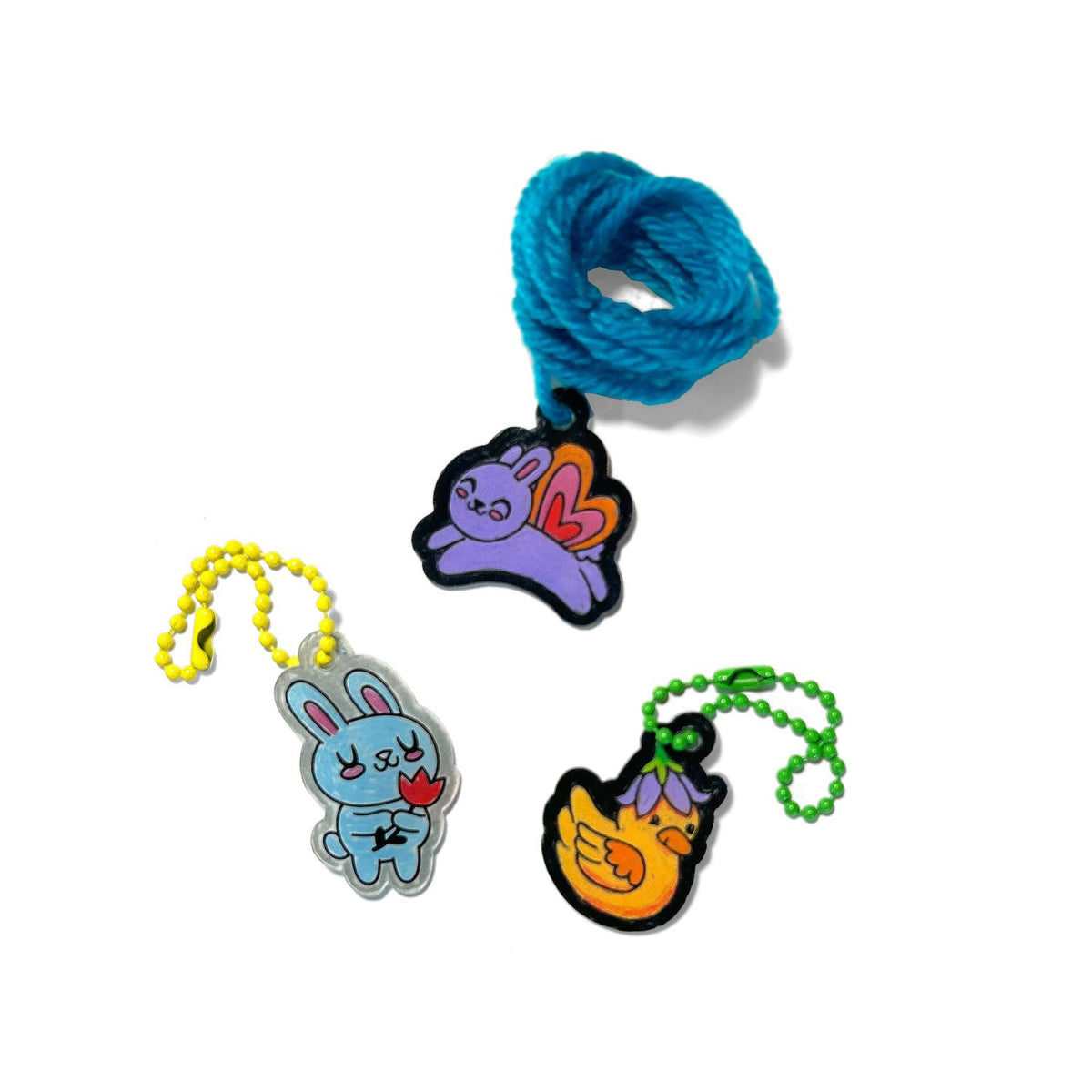 three of the Shrink-Its! DIY Shrink Art Kit featuring garden pals designs, with illustrations of a bunny amd Duck