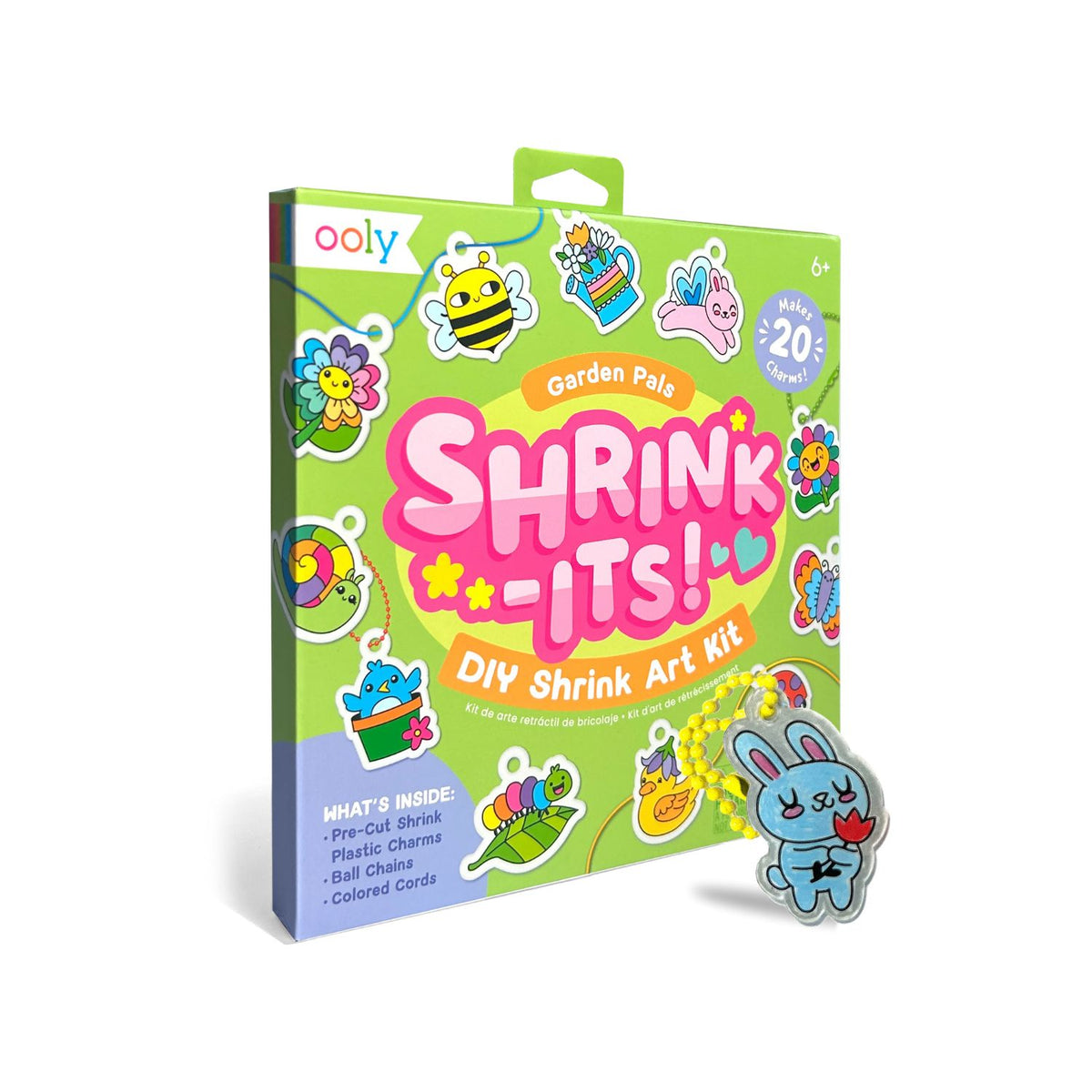 Packaging for Shrink-Its! DIY Shrink Art Kit featuring garden pals designs, with illustrations of a bunny, bee, and flower. The kit is for coloring, baking, and shrinking to create charms.