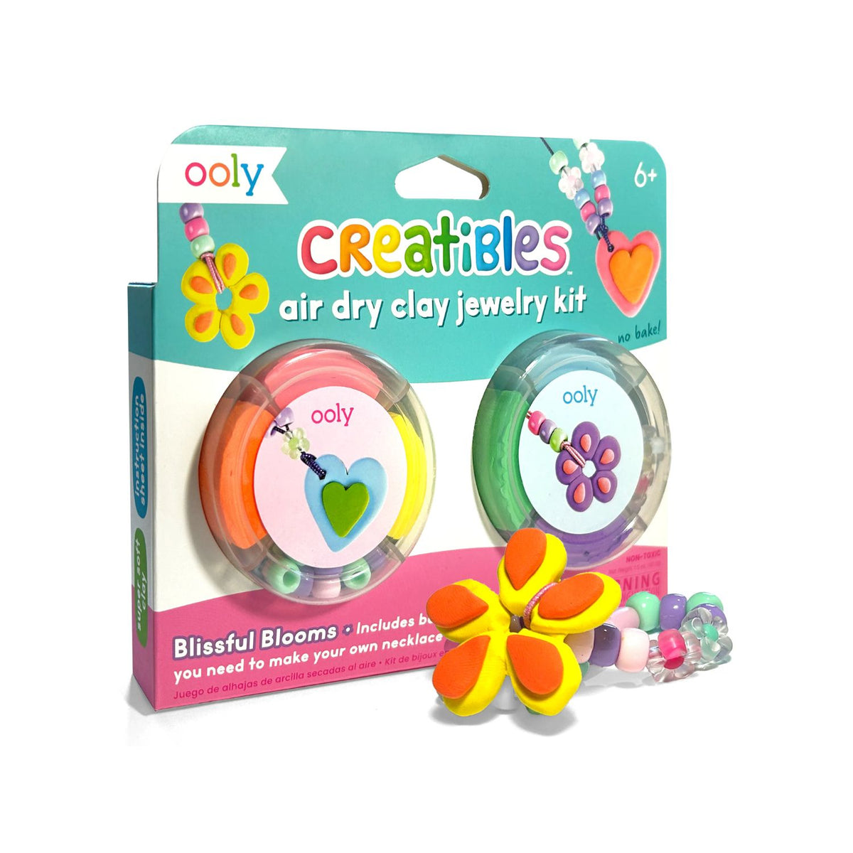 Packaging of Creatibles Air Dry Clay Jewelry Kit with six colors of clay, flower beads, pony beads, and elastic yarn displayed along with the brand ooly and the product name.