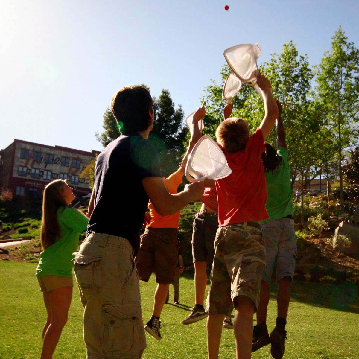 Group of Kids playing outside with Djubi Slingball