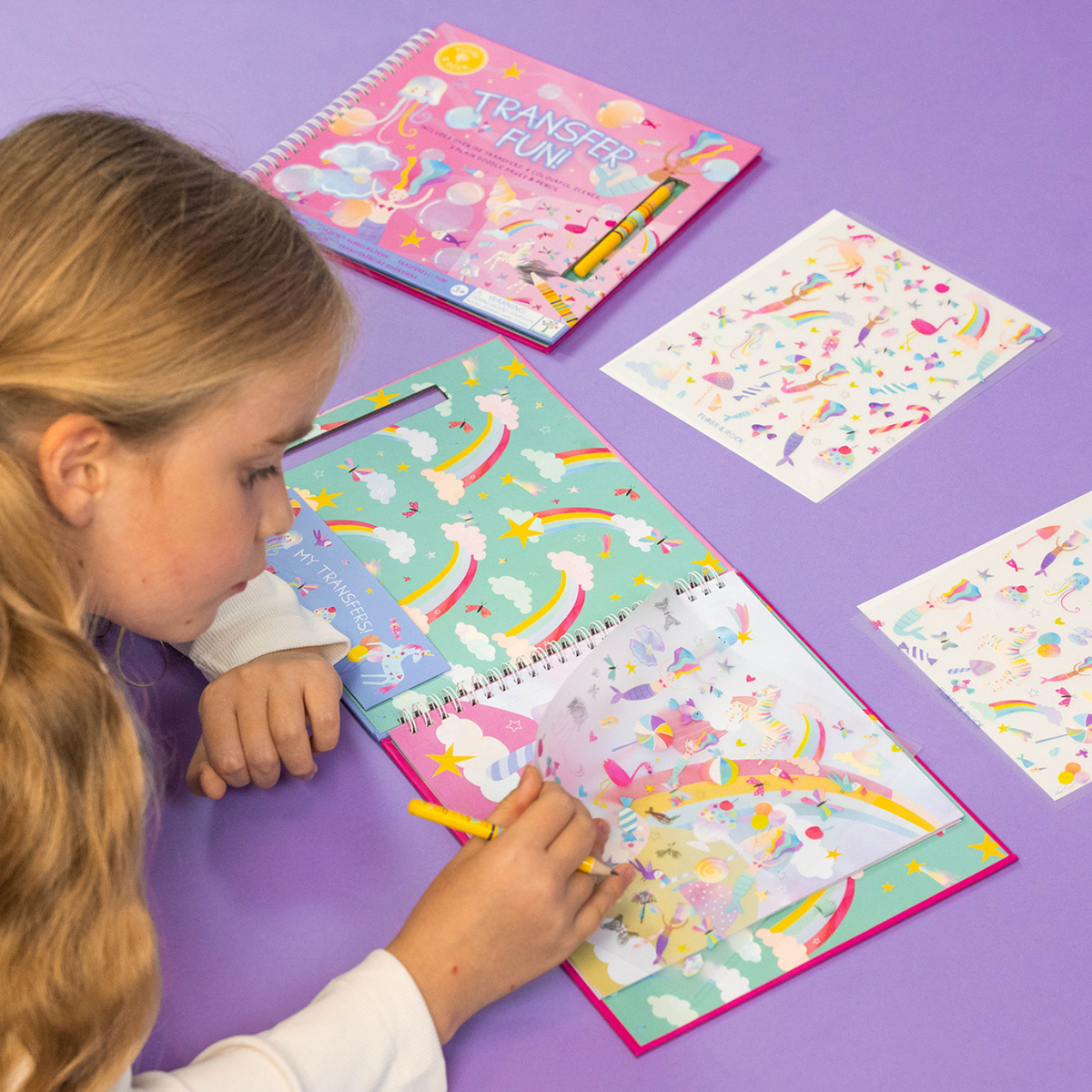 girl lying on the purple floor using the transfer fun