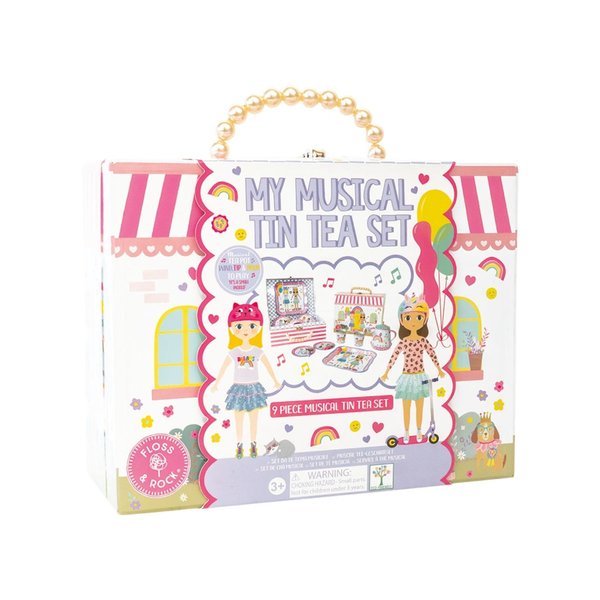 Boxed toy set for a musical tin tea party with two dolls on a white background