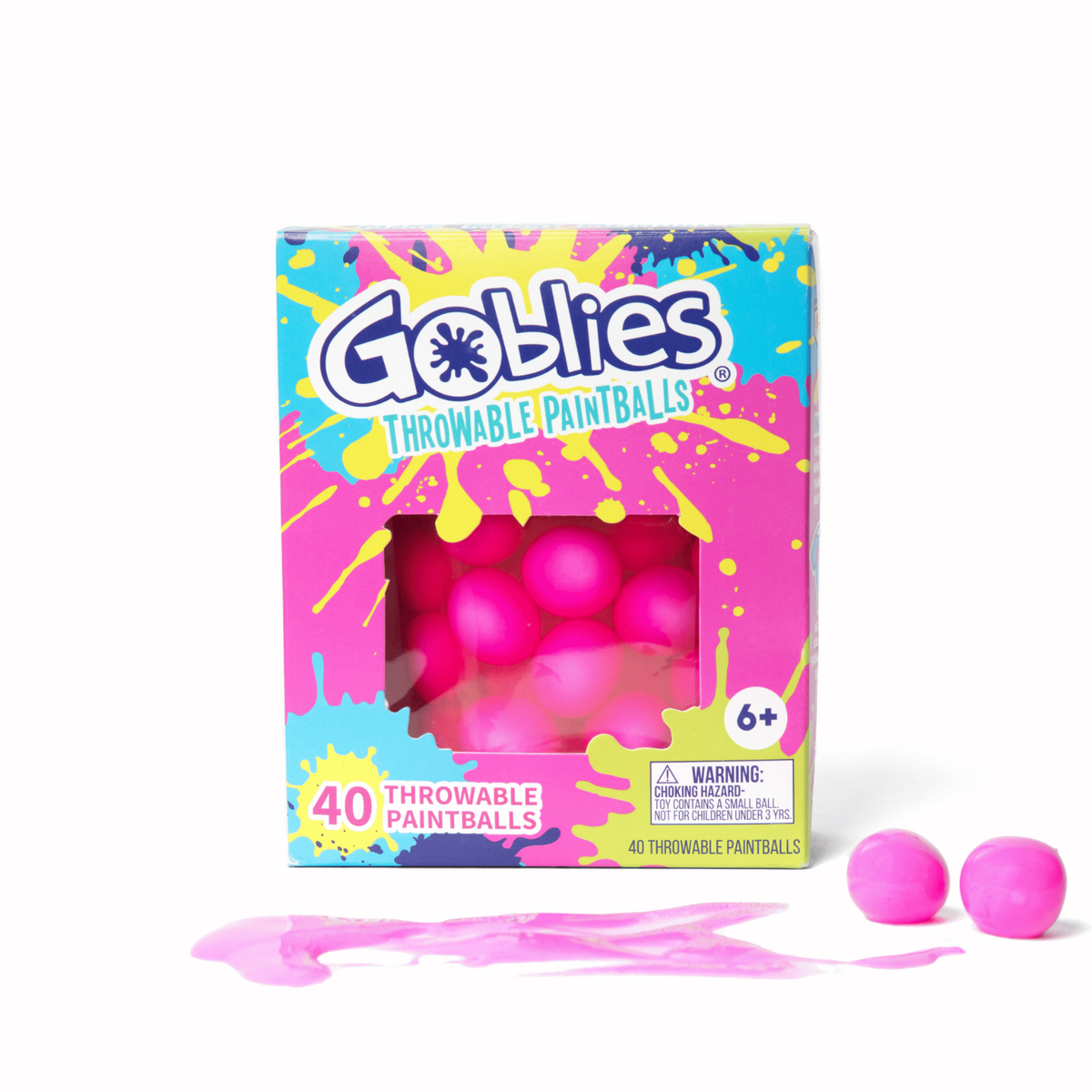 A package of Goblies throwable pink paintballs with several pink balls visible in front of the box. The box is vibrant with splashes of paint, indicating the product&#39;s color and playful nature.
