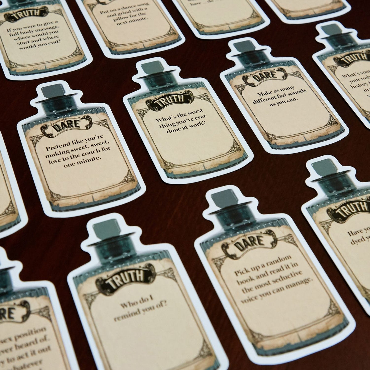 a close up shot of the cards, showing the clear layout dividing the "Terrible Truth" prompt from the "Comical Dare" option.