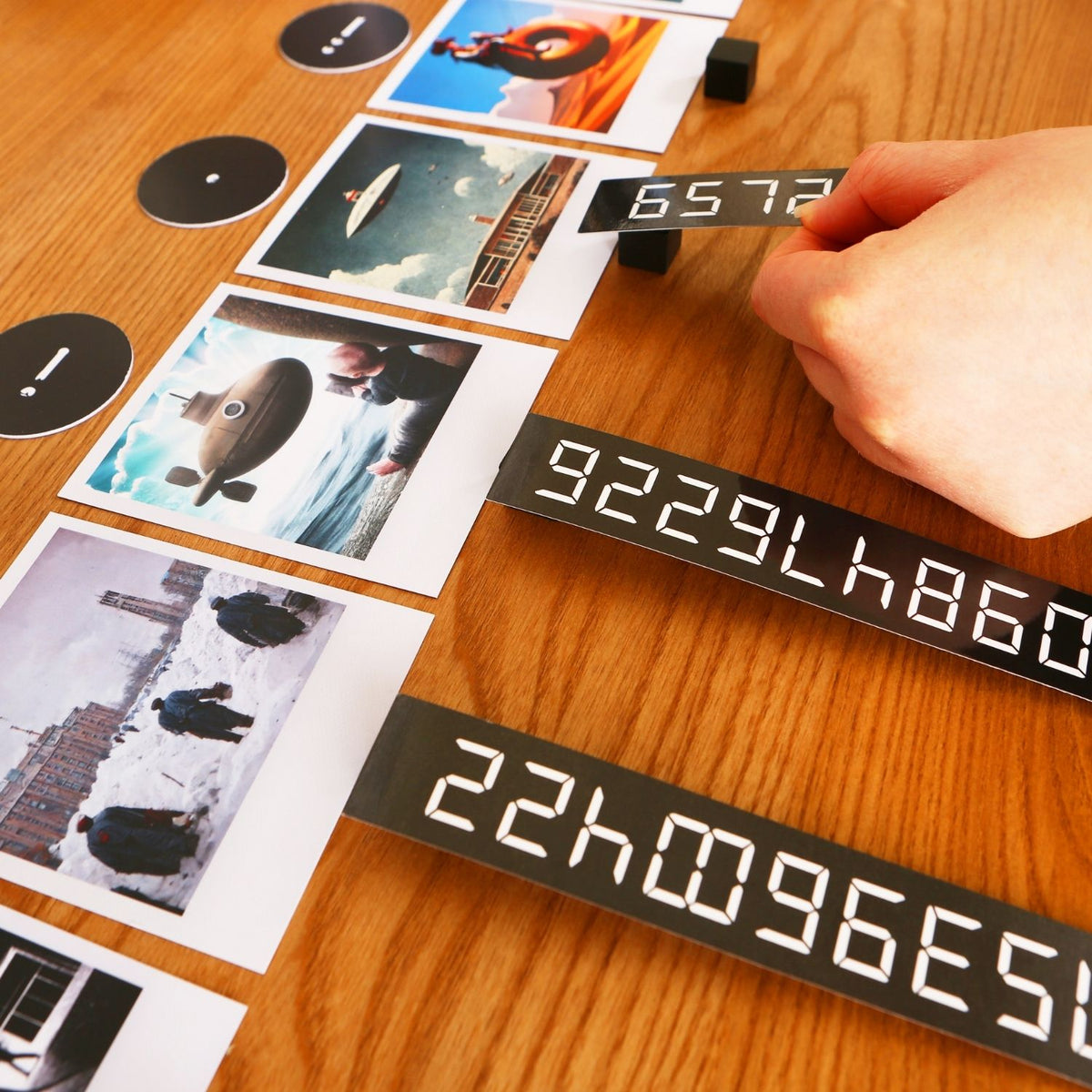 Digital display with numbers on a wooden surface with photos