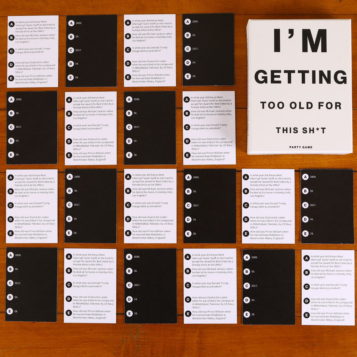 Collection of cards with humorous text on a wooden surface