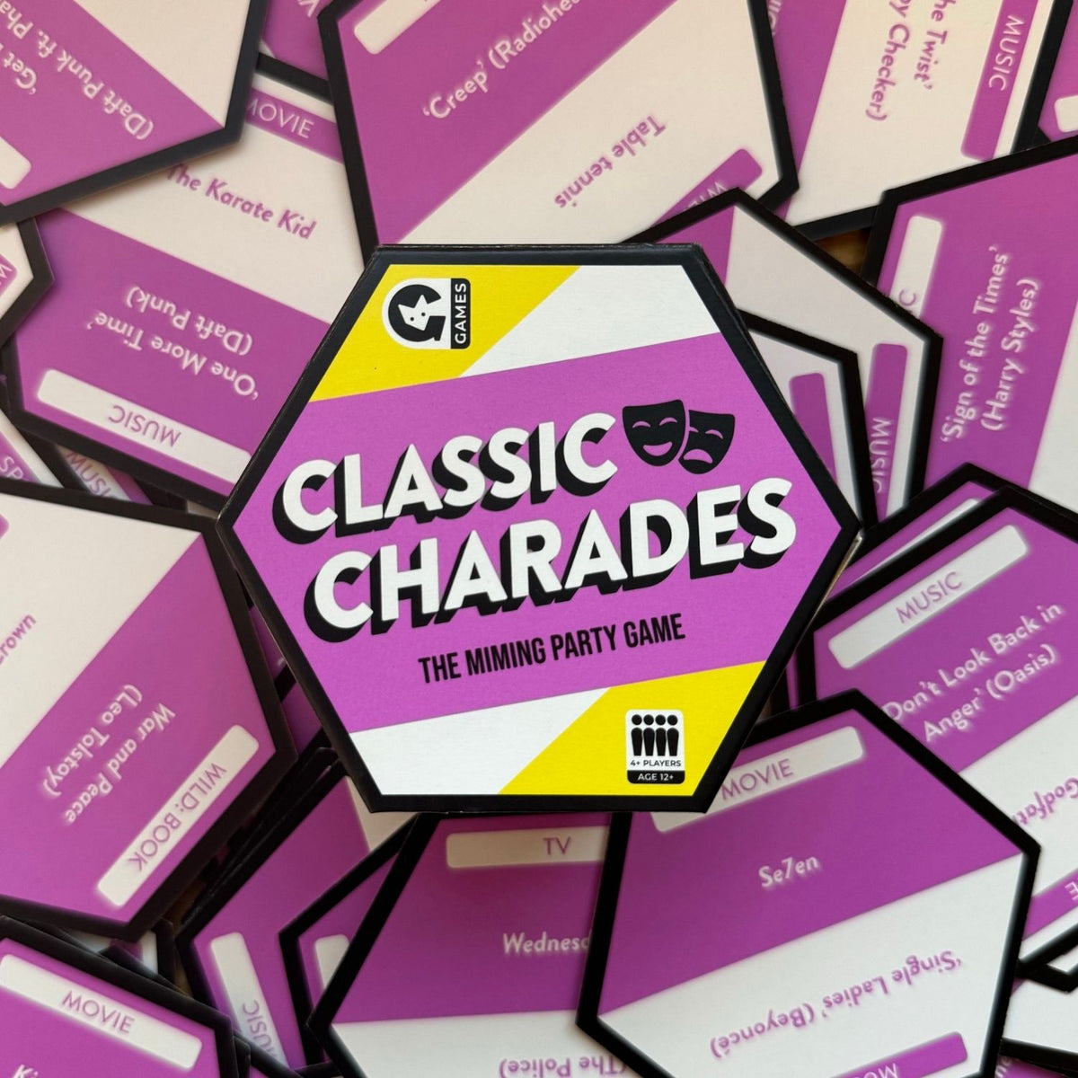 A colorful party game called &#39;Classic Charades&#39; presented in a triangular box with a vibrant design, featuring the text &#39;The Mining Party&#39; on the cover.