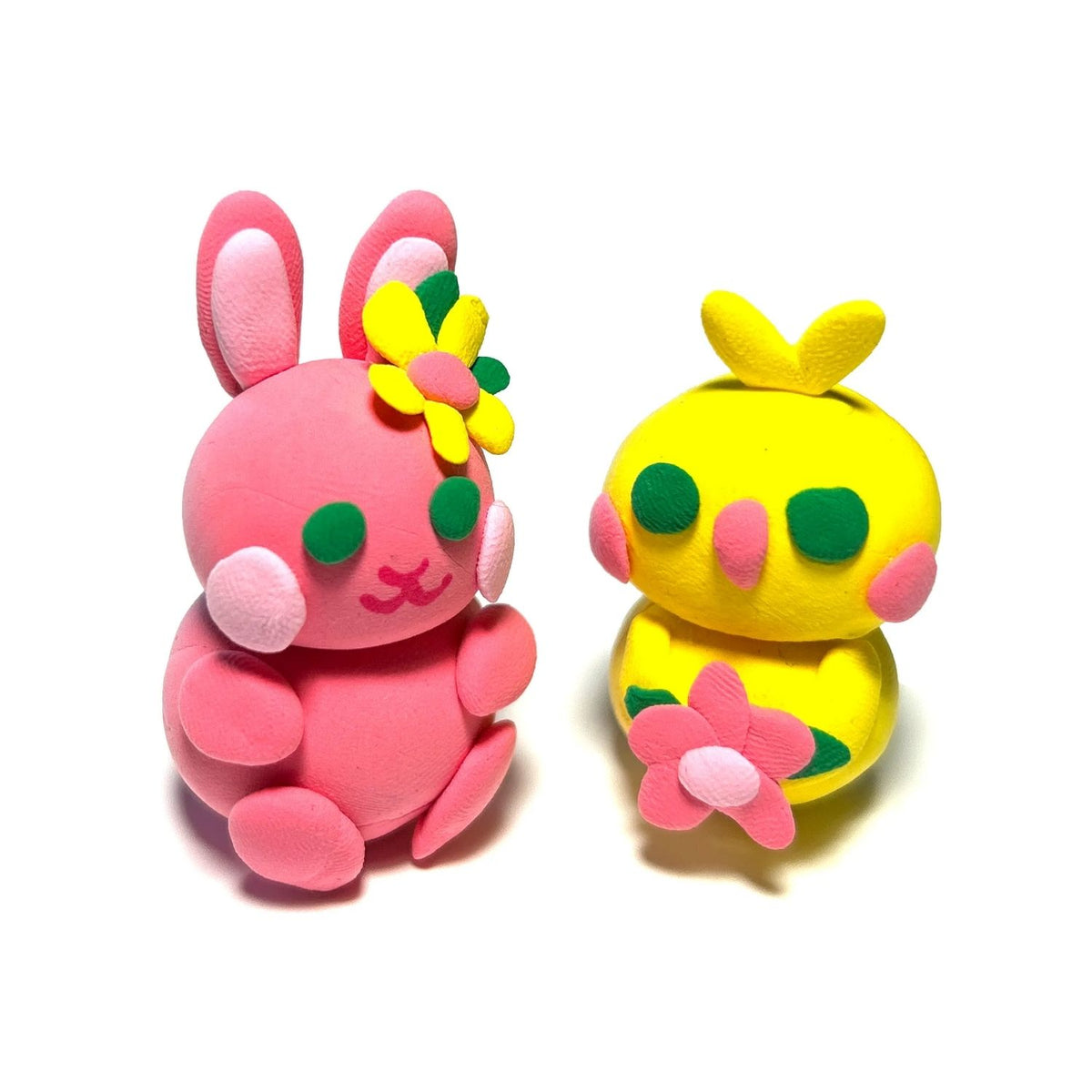 The completed clay bunny and chick standing side-by-side, showcasing the smooth, matte finish of the hardened air-dry material.