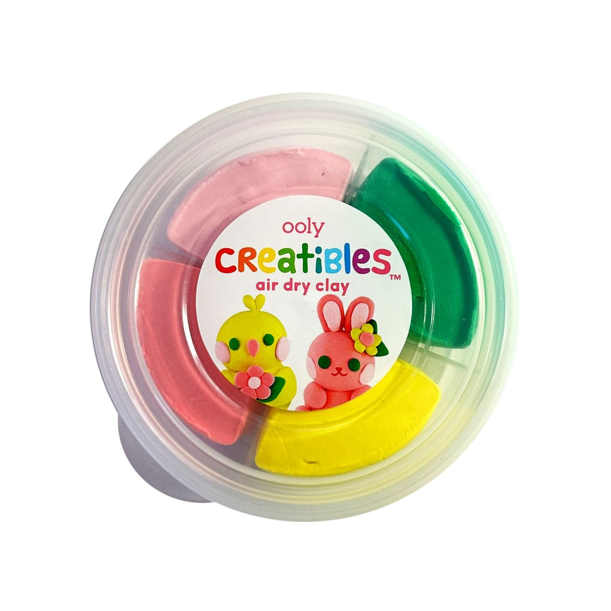 A top-down view inside the tub showing the four sealed packs of clay in green, light pink, dark pink, and yellow.