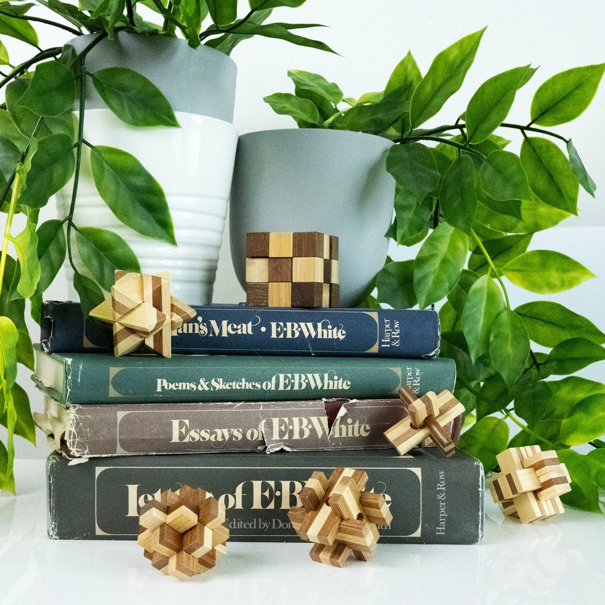 The six-pack of bamboo puzzles displayed on a wooden table, highlighting the eco-friendly materials and screen-free play value.