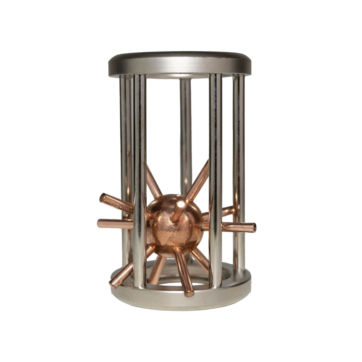 The Star puzzle featuring a polished metal star trapped within a geometric wire cage, part of a historical navigation-themed set for ages eight plus.