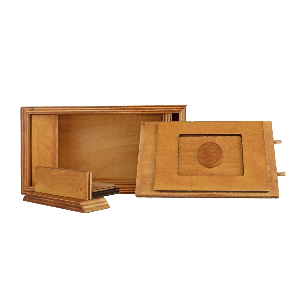 showing detail close-up of the Pharaoh’s Tomb puzzle box with the secret lid open, revealing the hidden internal chamber.