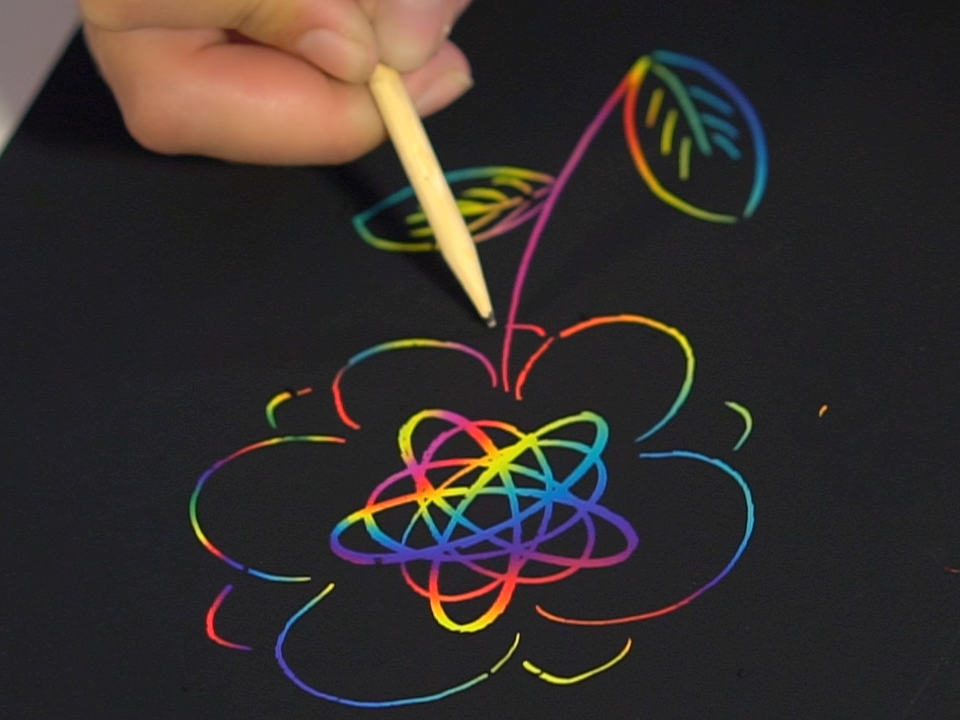 A package of Marvin&#39;s Magic Super Bright Scratch Art featuring a colorful design on the cover with a scratch art tool illustrated in the foreground.