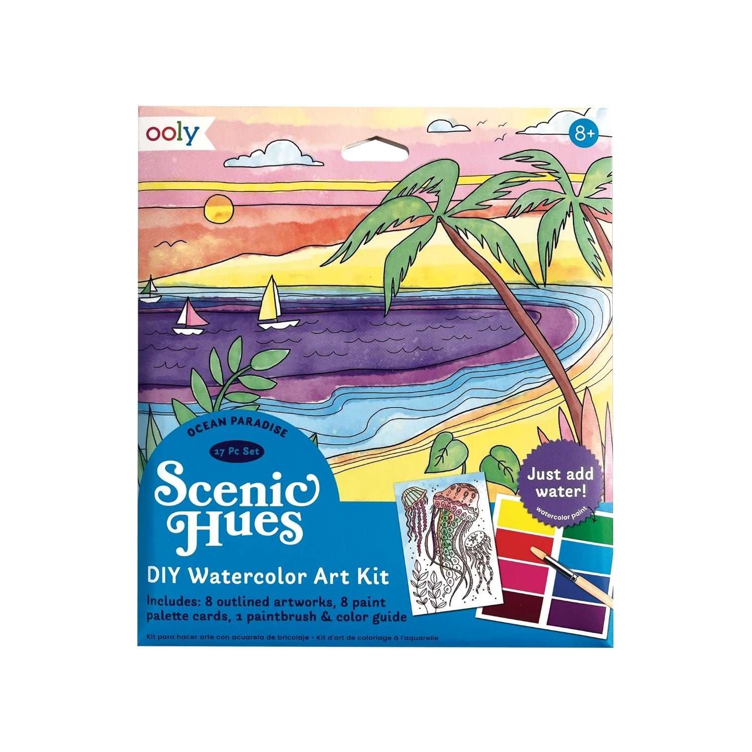 Packaging of Scenic Hues DIY Watercolour Art Kit with 'Ocean Paradise' theme showing illustrated images of palm trees, sun, and ocean waves. Includes paint palettes, paint brush, and color guide.
