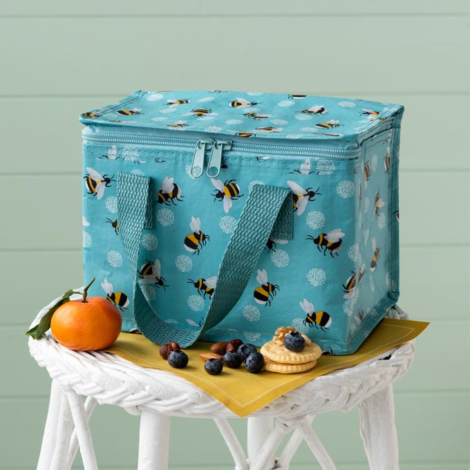 Bumblebees Insulated Lunch bag on a stool with food sitting infront